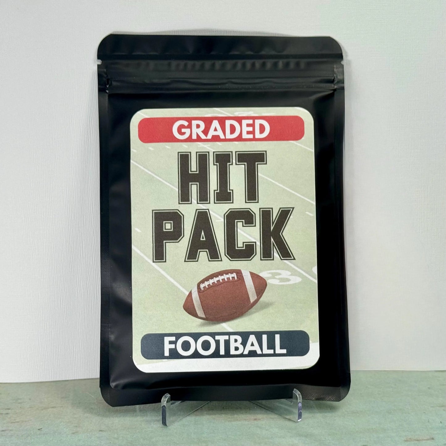 Graded Hit Pack™ – Football Edition – 1 Professionally Graded NFL Card (PSA, SGC, or BGS Slab)
